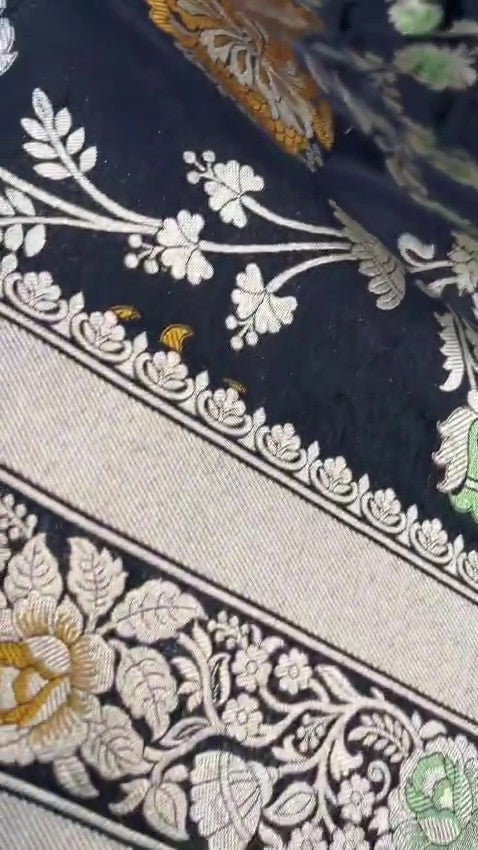 Midnight Black Handloom Banarasi Katan Silk Saree with Vibrant Meenakari Floral Motifs and Silk Mark Label.