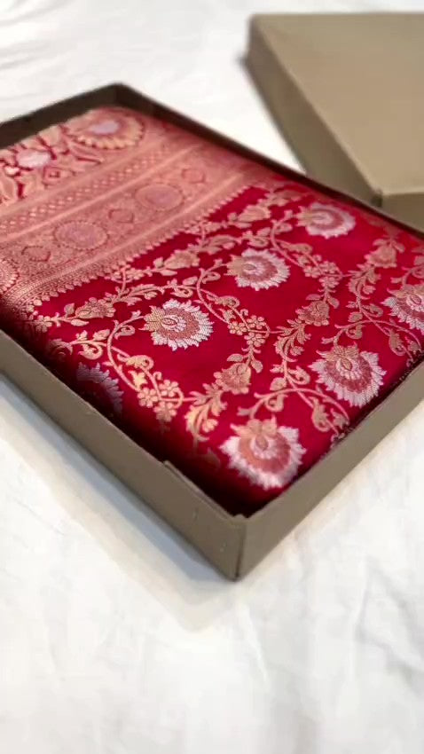 Red Banarasi Handloom Katan Silk Sona Rupa Saree showcasing the elaborate gold and silver Jangla patterned pallu and matching patterned border.