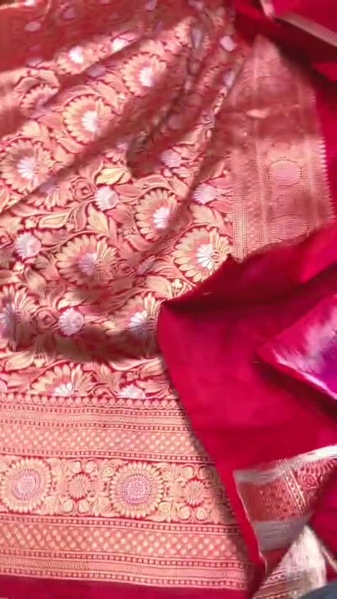 Red Banarasi Handloom Katan Silk Sona Rupa Saree showcasing the elaborate gold and silver Jangla patterned pallu and matching patterned border.