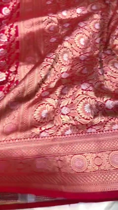 Red Banarasi Handloom Katan Silk Sona Rupa Saree showcasing the elaborate gold and silver Jangla patterned pallu and matching patterned border.