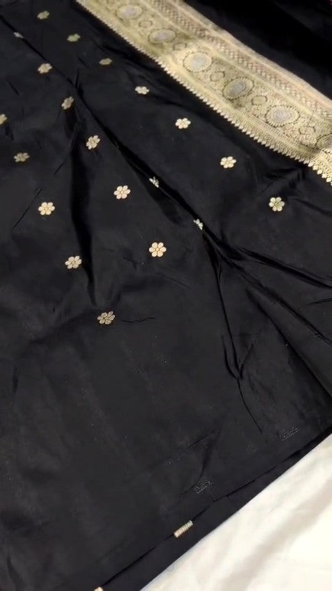 Detailed close-up view of the dense Sona Rupa Jangla floral and vine pattern woven across the black katan silk saree.