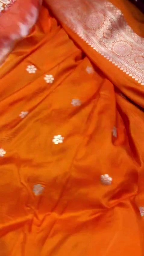 Orange traditional Katan Silk Sona Rupa Zari Banarasi saree, highlighting the craftsmanship.