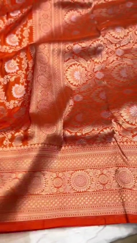 Orange traditional Katan Silk Sona Rupa Zari Banarasi saree, highlighting the craftsmanship.
