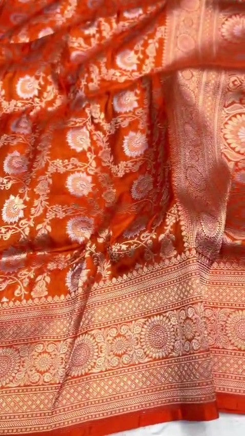 Orange traditional Katan Silk Sona Rupa Zari Banarasi saree, highlighting the craftsmanship.
