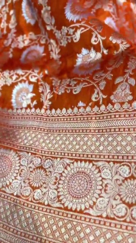 Orange traditional Katan Silk Sona Rupa Zari Banarasi saree, highlighting the craftsmanship.
