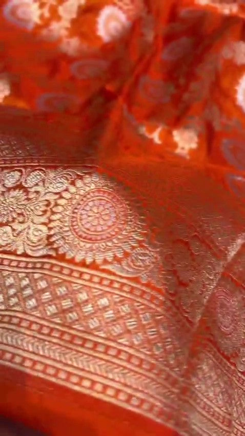 Orange traditional Katan Silk Sona Rupa Zari Banarasi saree, highlighting the craftsmanship.