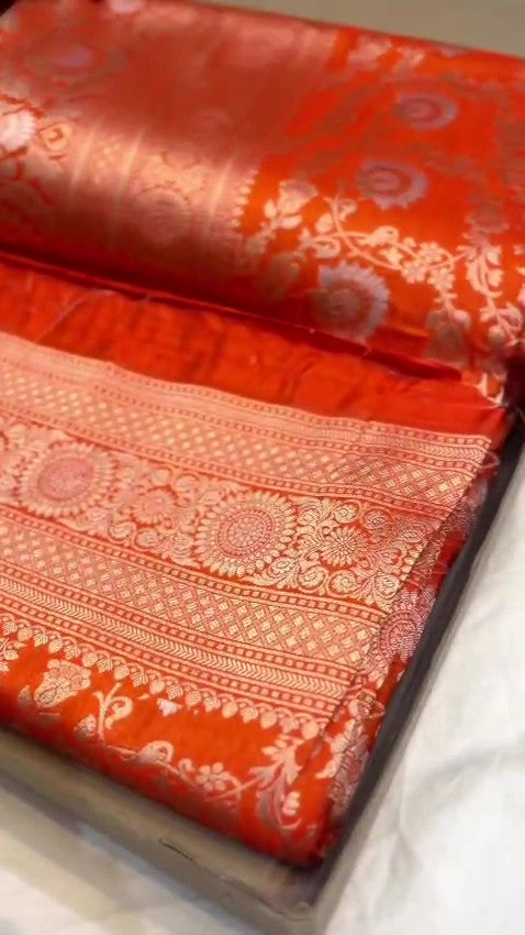 Orange traditional Katan Silk Sona Rupa Zari Banarasi saree, highlighting the craftsmanship.