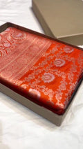 Orange traditional Katan Silk Sona Rupa Zari Banarasi saree, highlighting the craftsmanship.