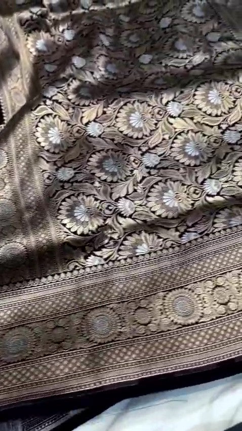 Detailed close-up view of the dense Sona Rupa Jangla floral and vine pattern woven across the black katan silk saree.