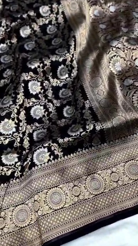 Detailed close-up view of the dense Sona Rupa Jangla floral and vine pattern woven across the black katan silk saree.
