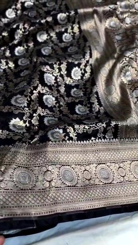 Detailed close-up view of the dense Sona Rupa Jangla floral and vine pattern woven across the black katan silk saree.