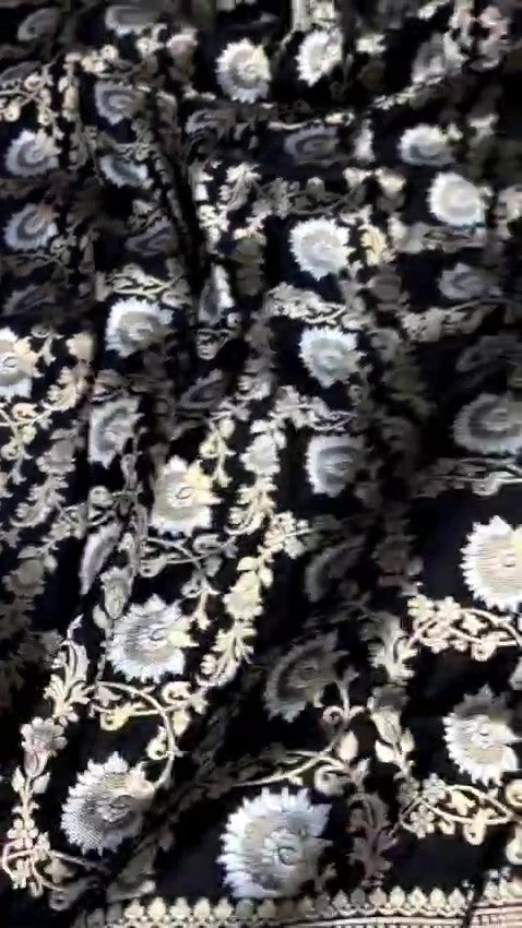Detailed close-up view of the dense Sona Rupa Jangla floral and vine pattern woven across the black katan silk saree.