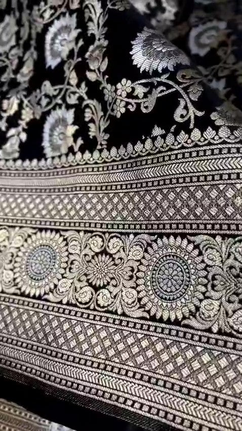 Detailed close-up view of the dense Sona Rupa Jangla floral and vine pattern woven across the black katan silk saree.
