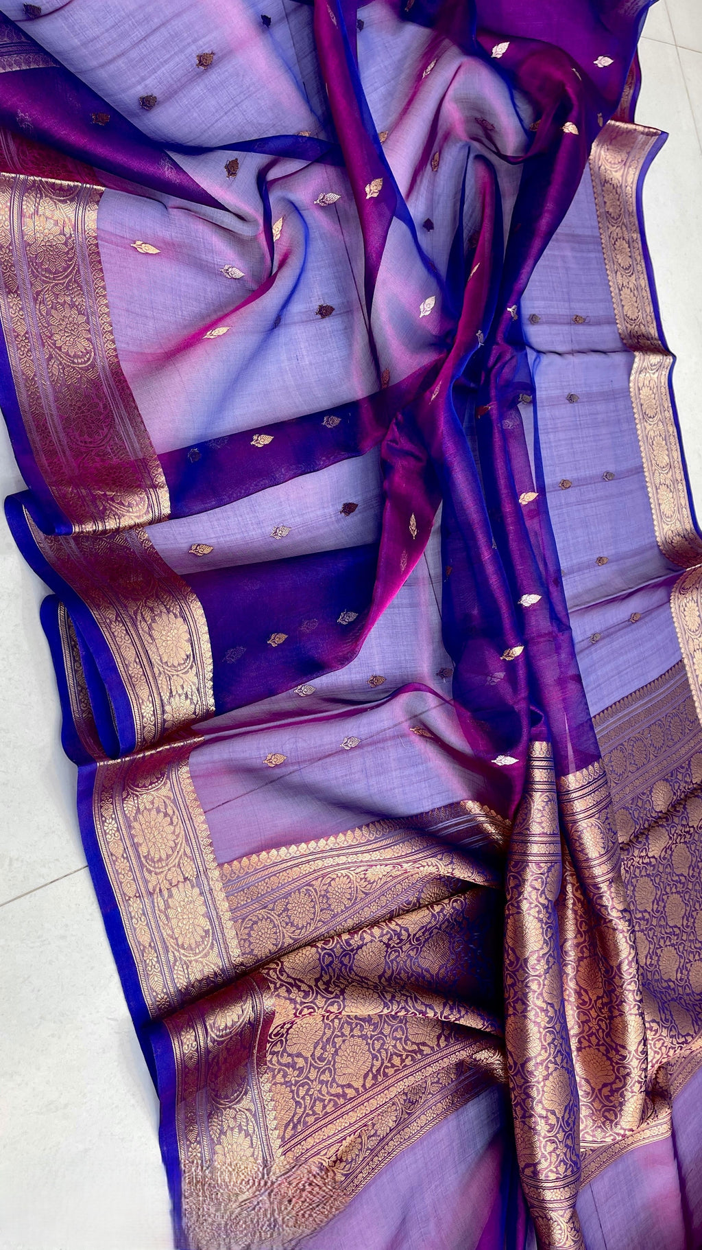 Dual Tone Blue Banarasi Handloom Kora Tissue Silk Saree featuring all-over gold and silver zari buttas, intricate gold zari borders, and a matching rich pallu.