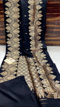 Black Banarasi handloom raw mango silk saree featuring rich mashru borders and intricate Kaduwa weaving.