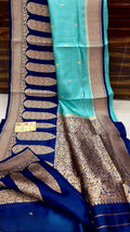 Turquoise Banarasi handloom raw mango silk saree featuring purple and gold mashru borders with intricate Kaduwa weaving.