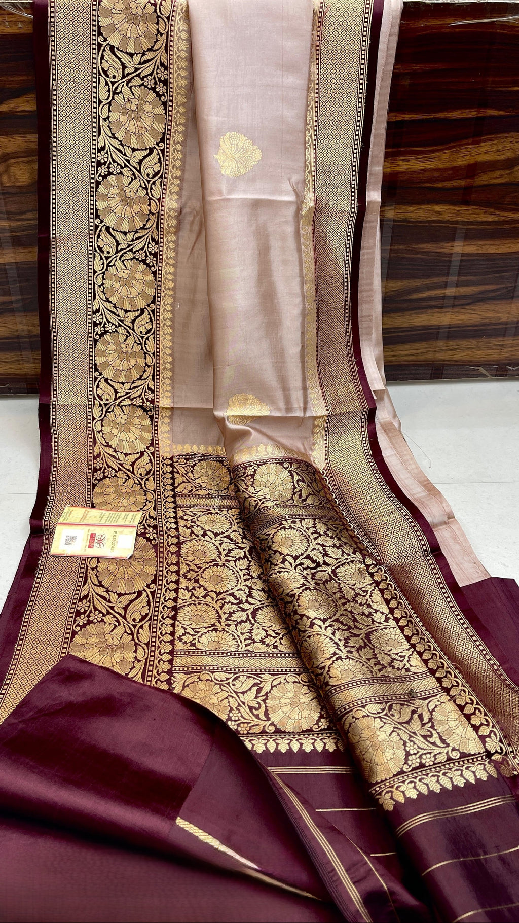 Elegant Beige Banarasi handloom raw mango silk saree with rich mashru borders and intricate Kaduwa weaving.