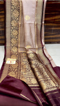 Elegant Beige Banarasi handloom raw mango silk saree with rich mashru borders and intricate Kaduwa weaving.