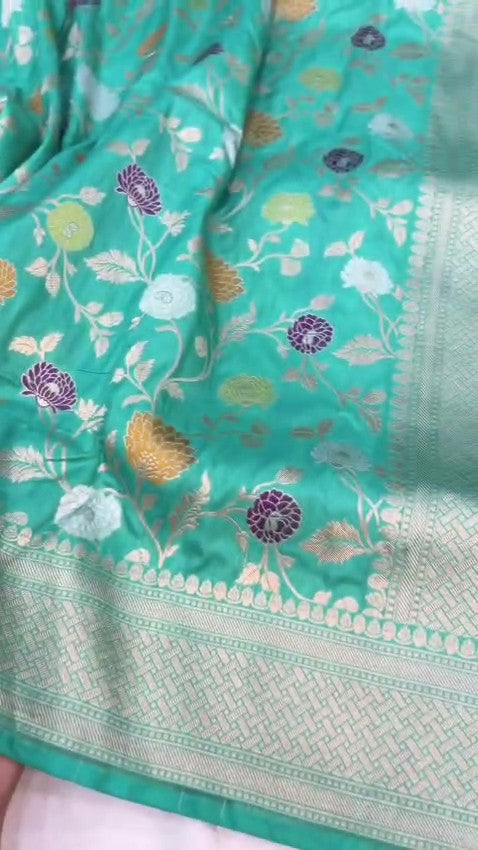 Elegant Teal Banarasi Handloom Katan silk saree with intricate multi-colored Meenakari floral motifs and detailed gold zari borders.