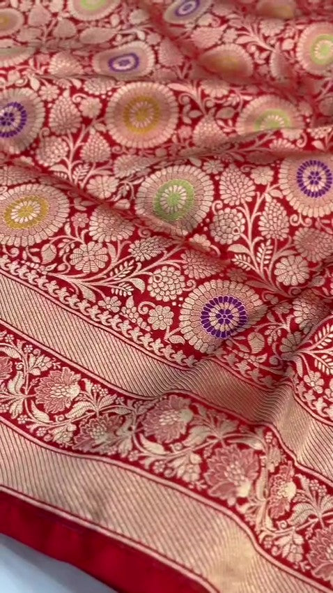 Chilly Red Banarasi Handloom Katan silk saree with intricate multicolored chakram motifs and ornate zari borders.