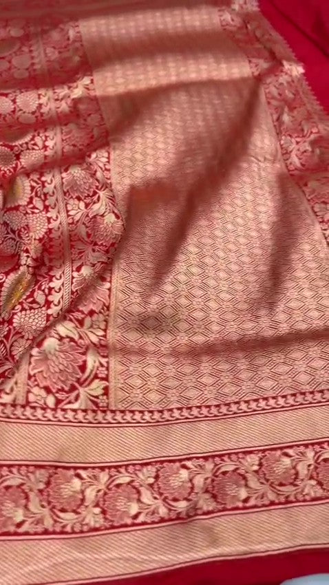 Chilly Red Banarasi Handloom Katan silk saree with intricate multicolored chakram motifs and ornate zari borders.