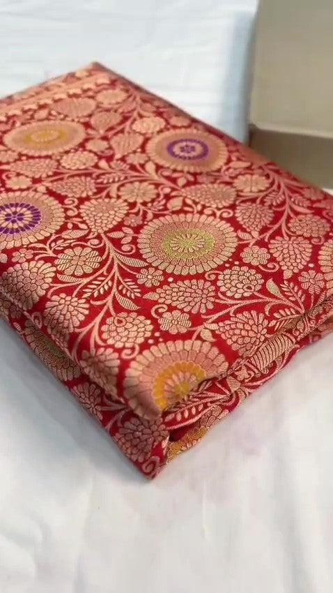 Chilly Red Banarasi Handloom Katan silk saree with intricate multicolored chakram motifs and ornate zari borders.