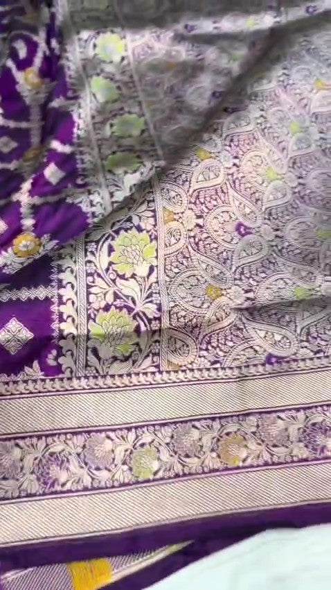 Regal Purple Banarasi Handloom Katan Silk saree with intricate multi-colored Meenakari floral motifs and detailed silver zari borders.