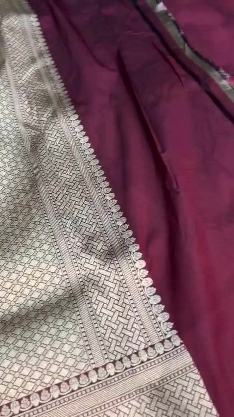 Burgundy Banarasi Handloom Katan Silk saree with elaborate multi-colored Meenakari floral motifs and grand gold zari borders.