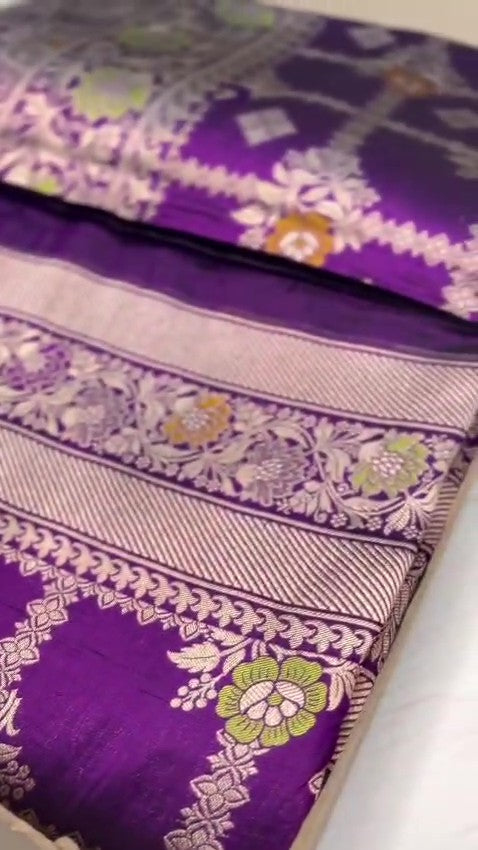 Regal Purple Banarasi Handloom Katan Silk saree with intricate multi-colored Meenakari floral motifs and detailed silver zari borders.