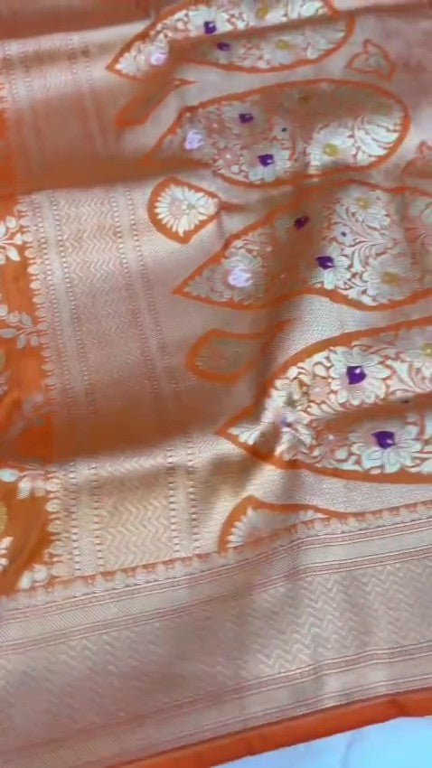 Elegant dual-tone orange Banarasi handloom Katan silk saree with intricate Meenakari floral weaving and gold zari borders.