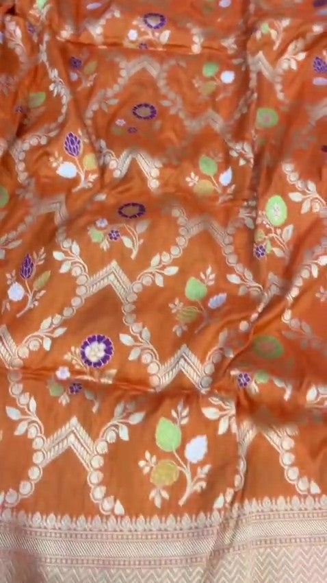 Elegant dual-tone orange Banarasi handloom Katan silk saree with intricate Meenakari floral weaving and gold zari borders.
