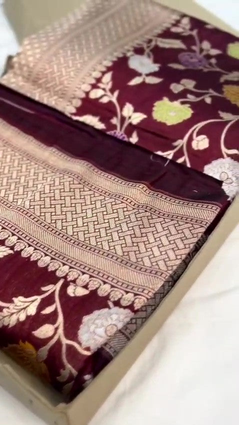 Burgundy Banarasi Handloom Katan Silk saree with elaborate multi-colored Meenakari floral motifs and grand gold zari borders.