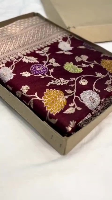 Burgundy Banarasi Handloom Katan Silk saree with elaborate multi-colored Meenakari floral motifs and grand gold zari borders.