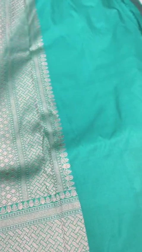 Elegant Teal Banarasi Handloom Katan silk saree with intricate multi-colored Meenakari floral motifs and detailed gold zari borders.