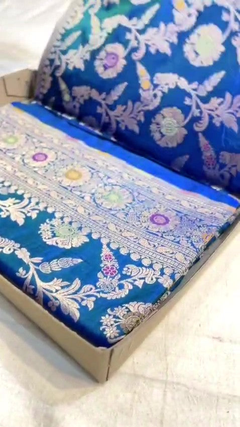 Peacock blue Banarasi handloom pure katan silk saree featuring intricate silver zari weaving and colorful Meenakari floral motifs