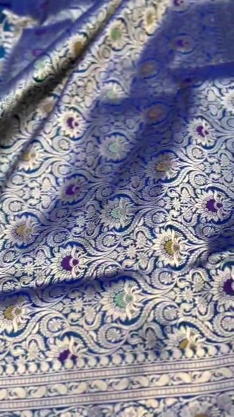 Peacock blue Banarasi handloom pure katan silk saree featuring intricate silver zari weaving and colorful Meenakari floral motifs