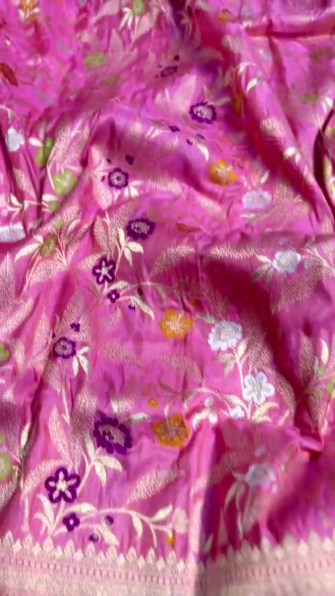 Dark pink Banarasi handloom pure katan silk saree featuring intricate gold zari weaving and colorful Meenakari floral motifs.
