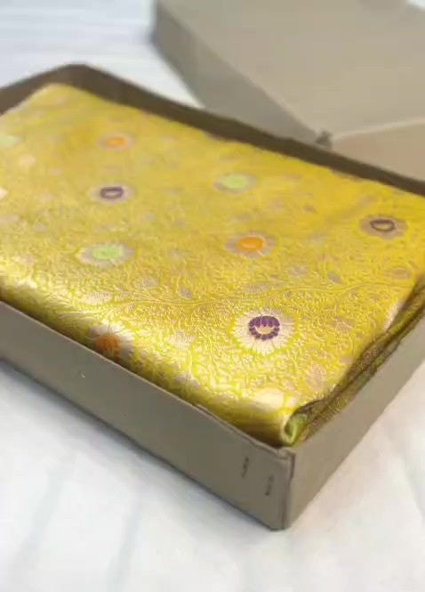 Yellow Banarasi Handloom Pure Katan Silk Saree with intricate floral jaal weave and colorful Meenakari bootis.