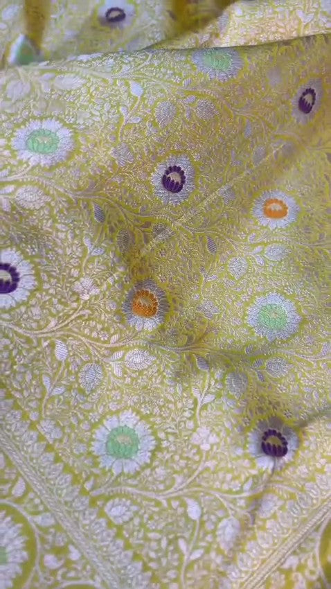 Yellow Banarasi Handloom Pure Katan Silk Saree with intricate floral jaal weave and colorful Meenakari bootis.