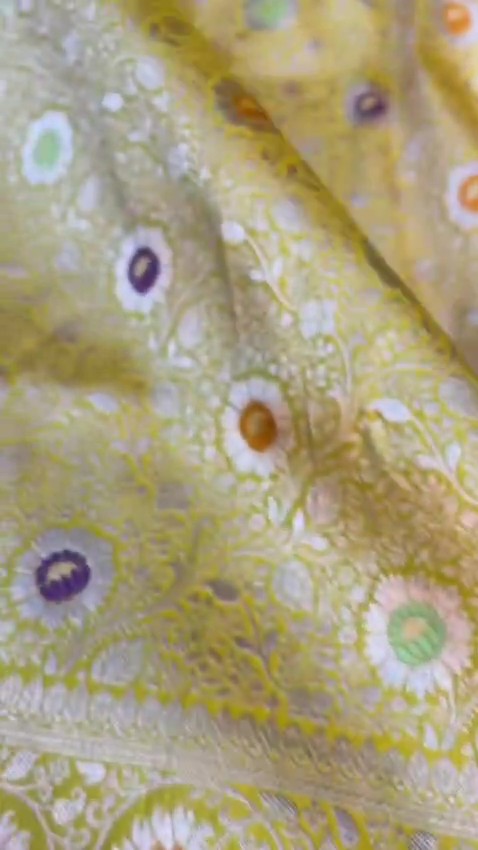Yellow Banarasi Handloom Pure Katan Silk Saree with intricate floral jaal weave and colorful Meenakari bootis.