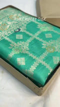 Sea Green Banarasi Handloom Pure Katan Silk Saree featuring all-over check weaves and Meenakari floral work.
