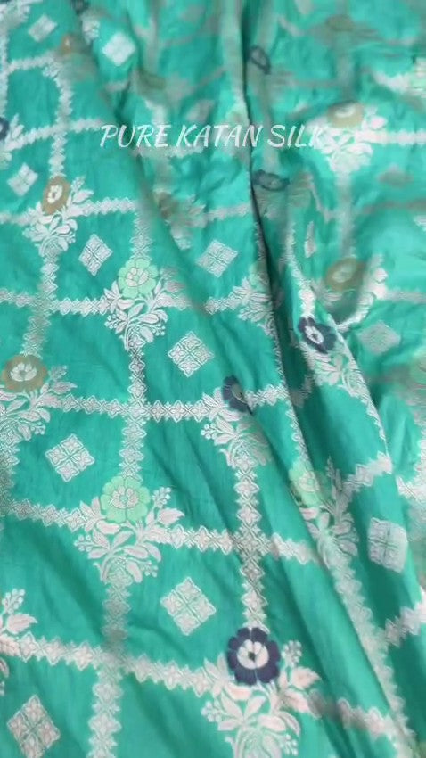 Sea Green Banarasi Handloom Pure Katan Silk Saree featuring all-over check weaves and Meenakari floral work.