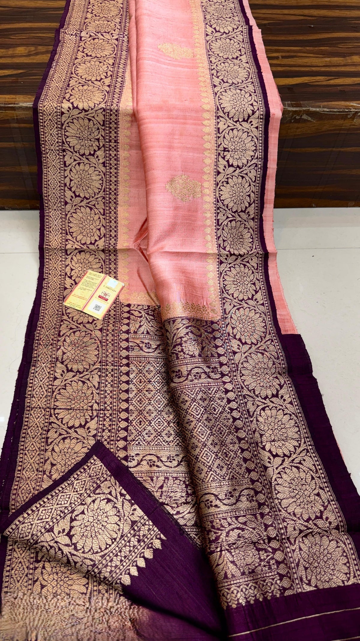Banarasi handloom raw silk Kaduwa saree featuring intricate gold zari floral motifs and rich contrast borders, available in multiple color options with Silk Mark certification.