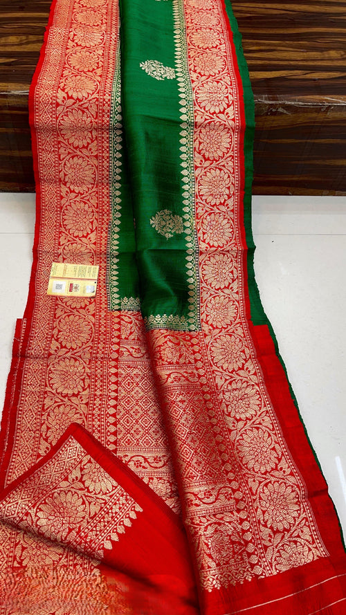 Banarasi handloom raw silk Kaduwa saree featuring intricate gold zari floral motifs and rich contrast borders, available in multiple color options with Silk Mark certification.