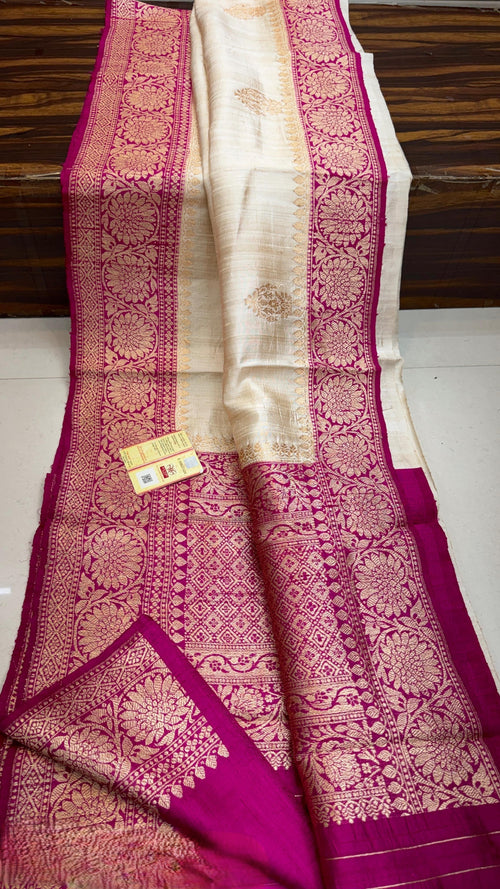 Banarasi handloom raw silk Kaduwa saree featuring intricate gold zari floral motifs and rich contrast borders, available in multiple color options with Silk Mark certification.