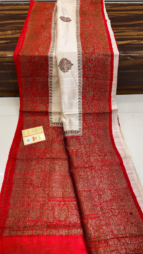Banarasi handloom raw silk Kaduwa saree featuring intricate gold zari floral motifs and rich contrast borders, available in multiple color options with Silk Mark certification.