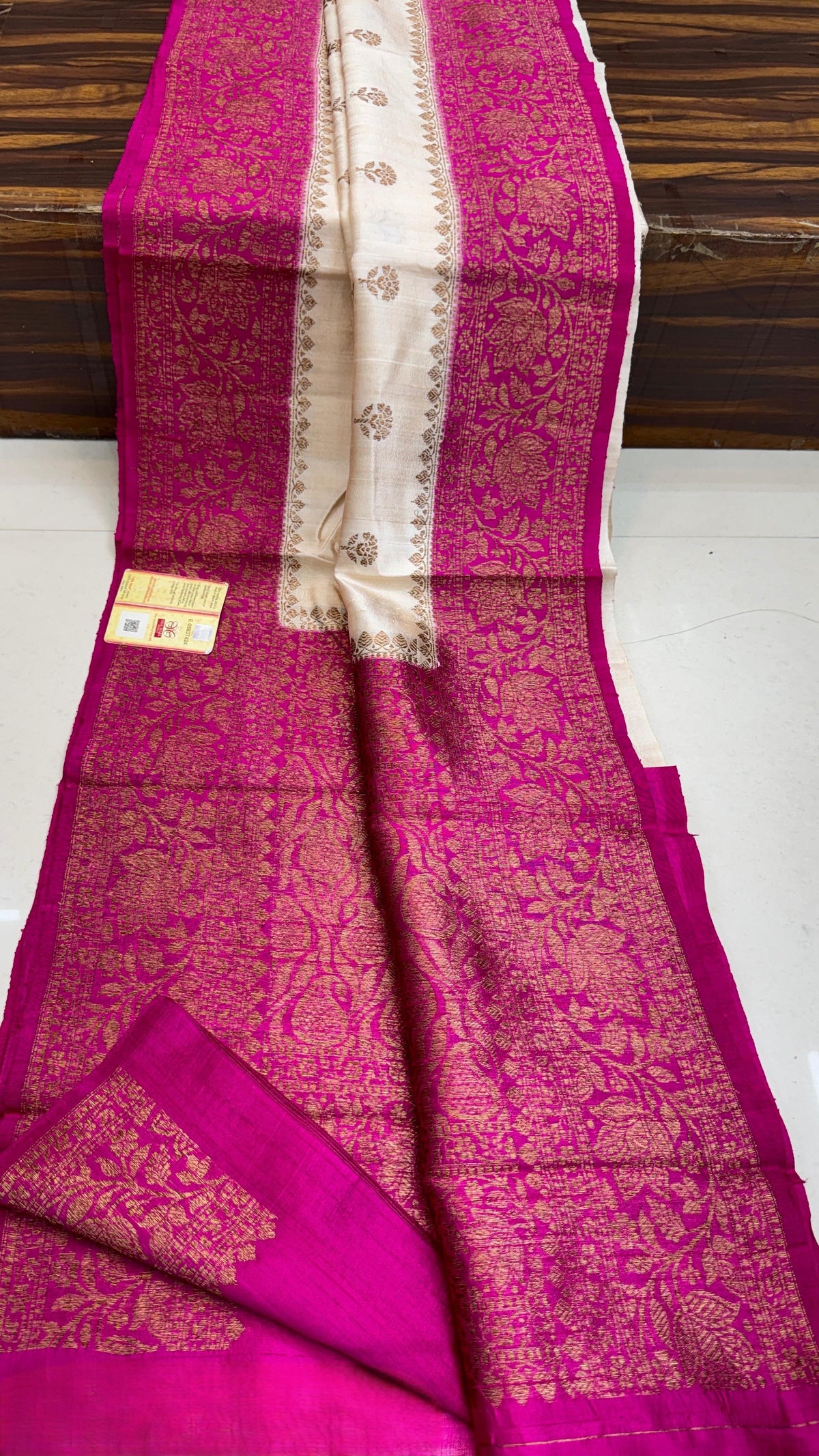 Banarasi handloom raw silk Kaduwa saree featuring intricate gold zari floral motifs and rich contrast borders, available in multiple color options with Silk Mark certification.