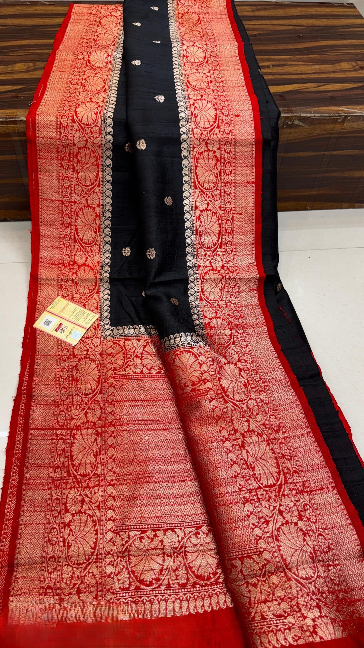 Banarasi handloom raw silk Kaduwa saree featuring intricate gold zari floral motifs and rich contrast borders, available in multiple color options with Silk Mark certification.