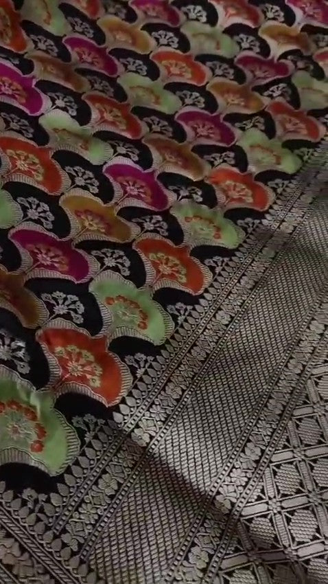 Black Banarasi handloom Katan silk Rangkaat Meenakari saree with intricate silver zari work and vibrant motifs.