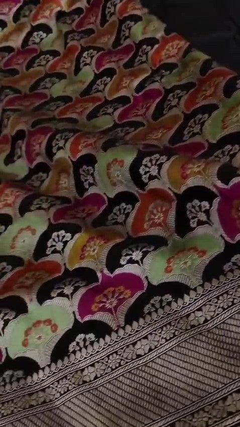 Black Banarasi handloom Katan silk Rangkaat Meenakari saree with intricate silver zari work and vibrant motifs.